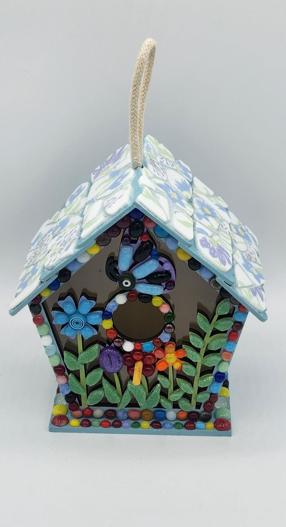Colorful mosaic birdhouse