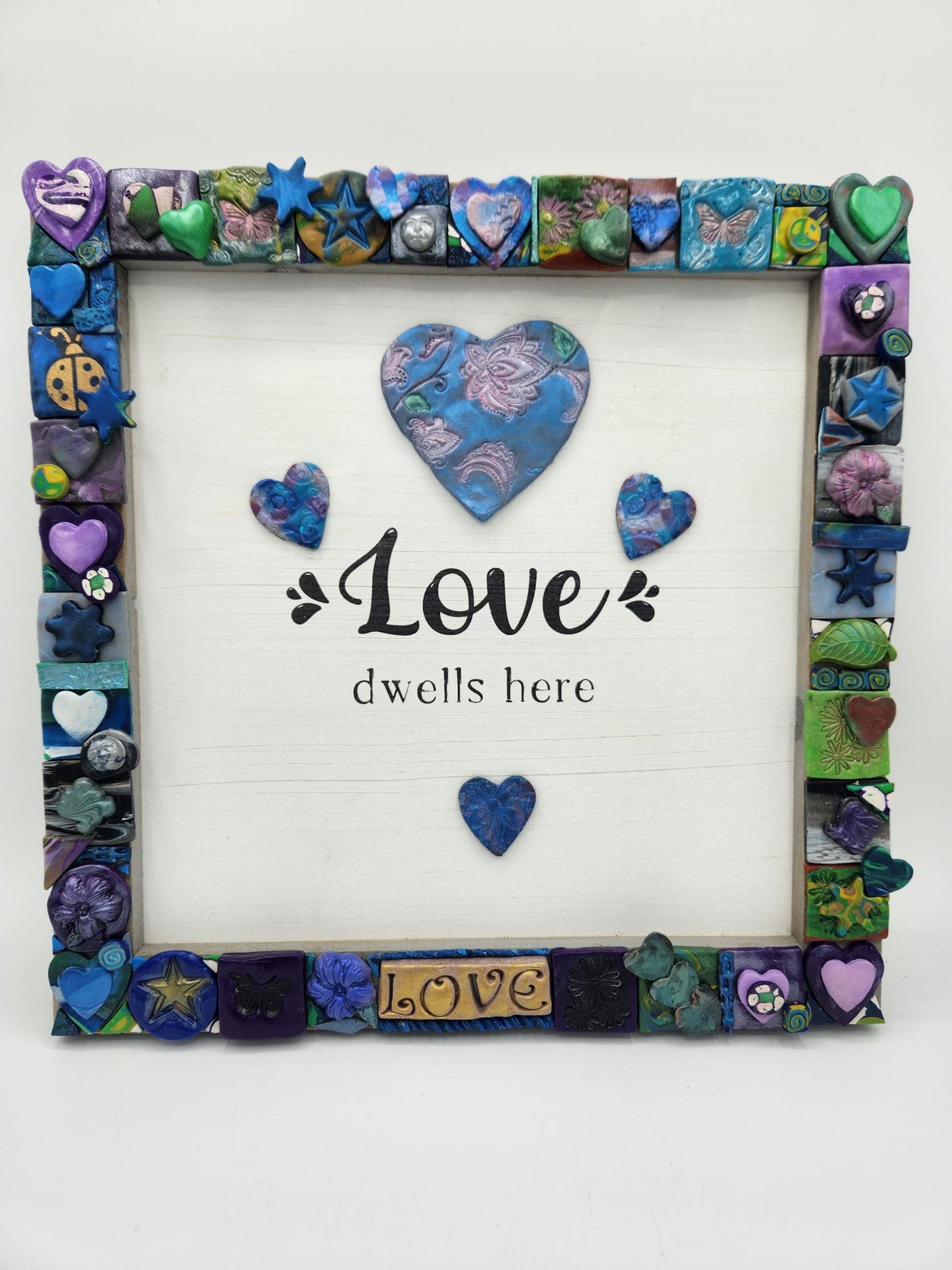 Polymer clay frame with Love.