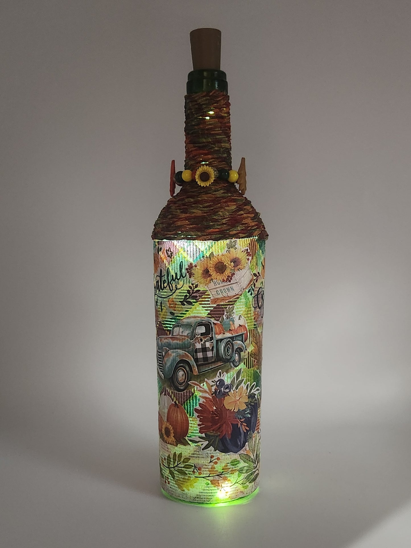 Decorative fall wine bottle with light