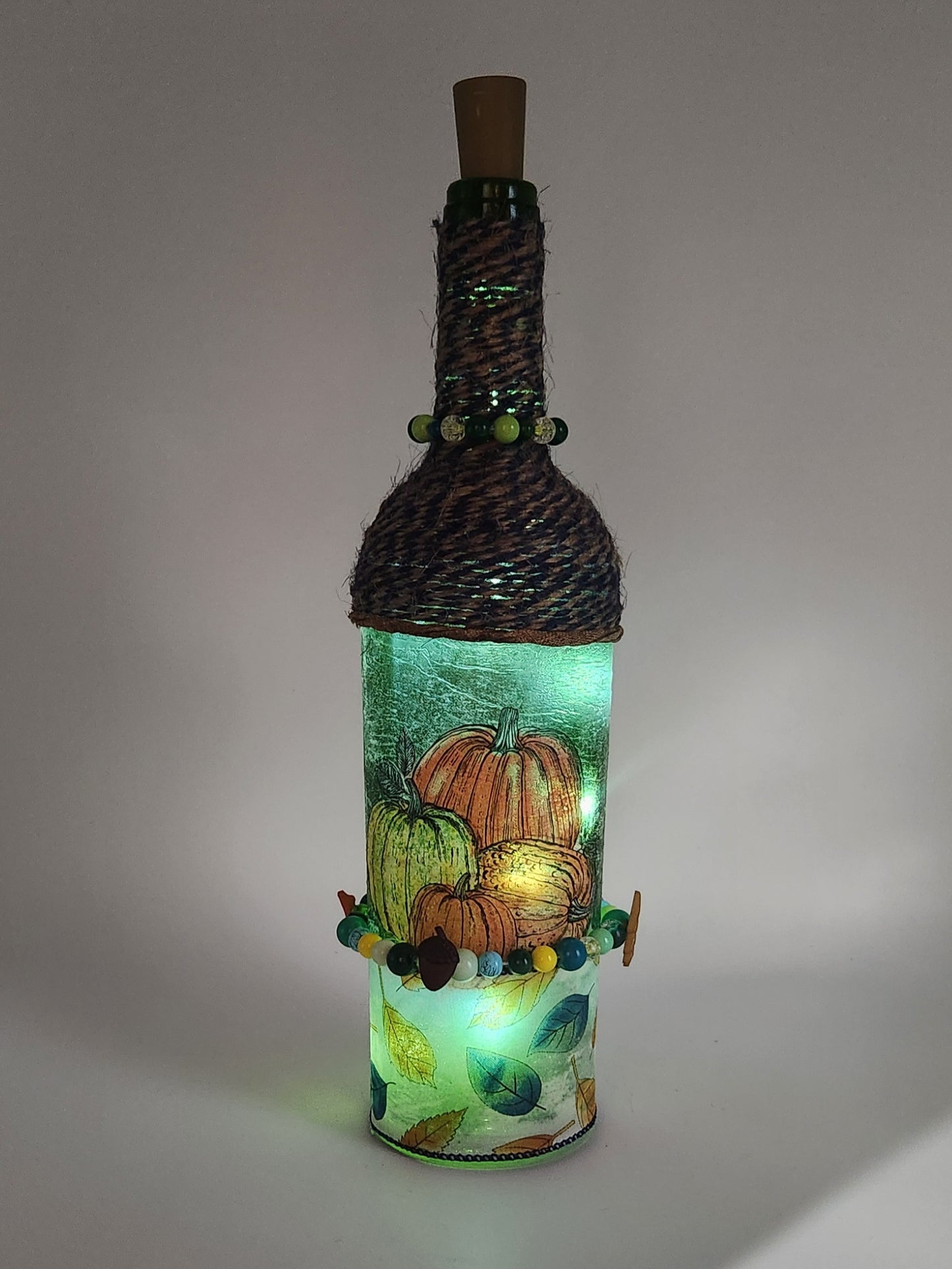 Decorative fall wine bottle with fairy lights