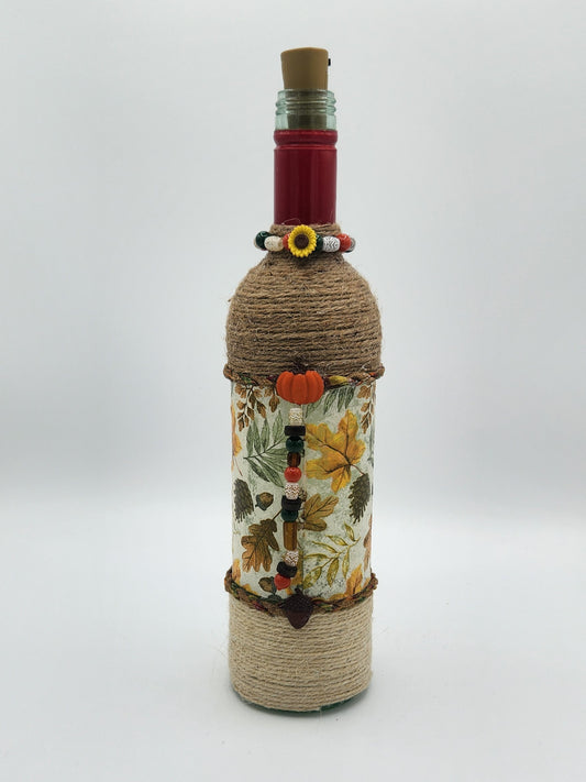 Decorative fall wine bottle with fairy lights