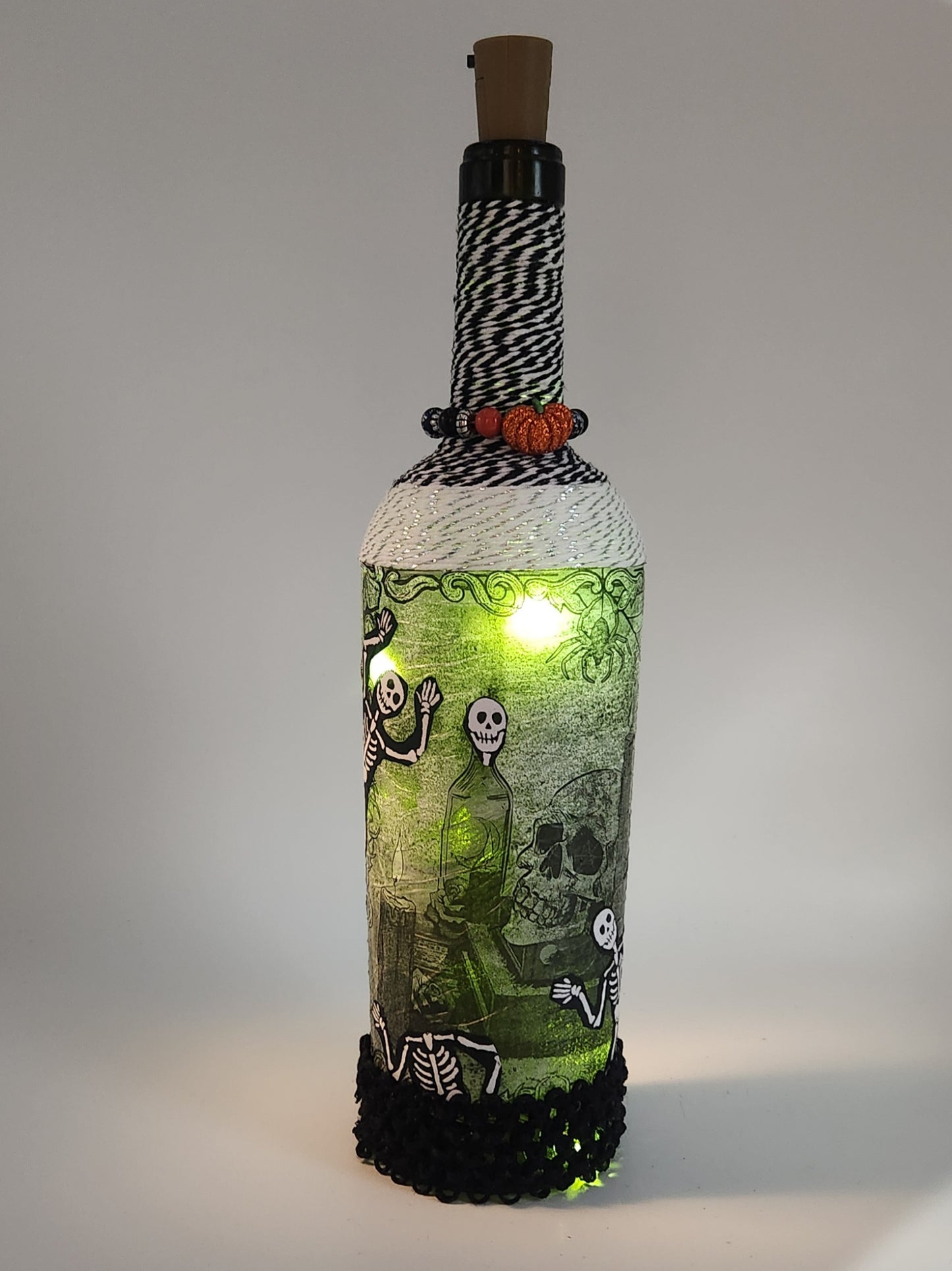 Decorative Halloween wine bottle with fairy lights.