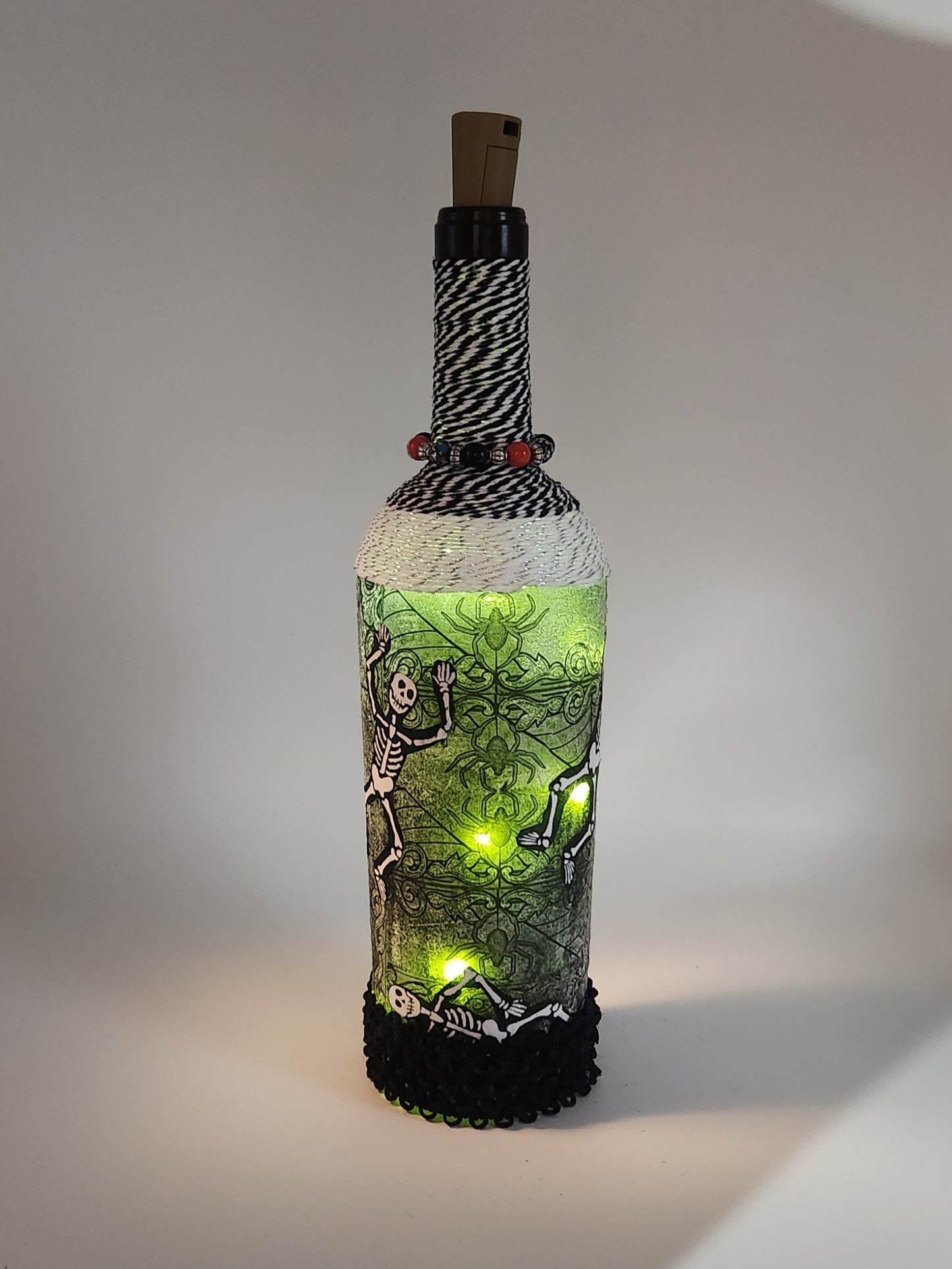 Decorative Halloween wine bottle with fairy lights.