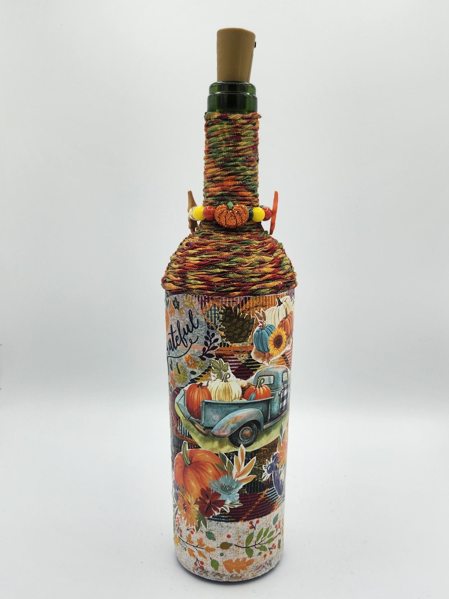 Decorative fall wine bottle with light