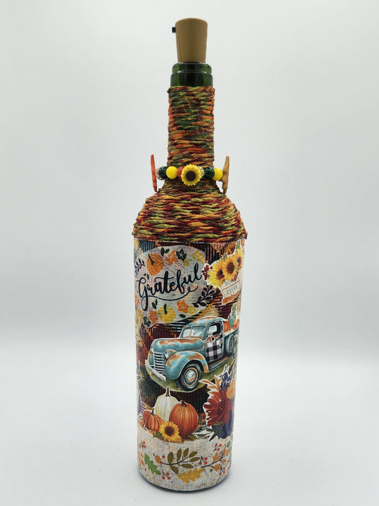 Decorative fall wine bottle with light