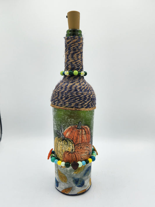 Decorative fall wine bottle with fairy lights